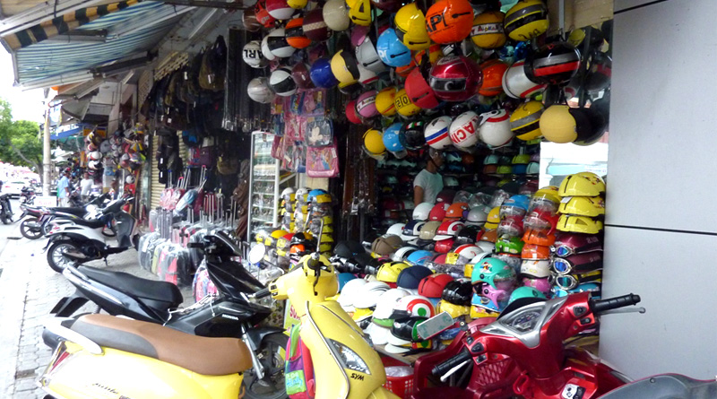 People are taking helmet for rent for getting petrol