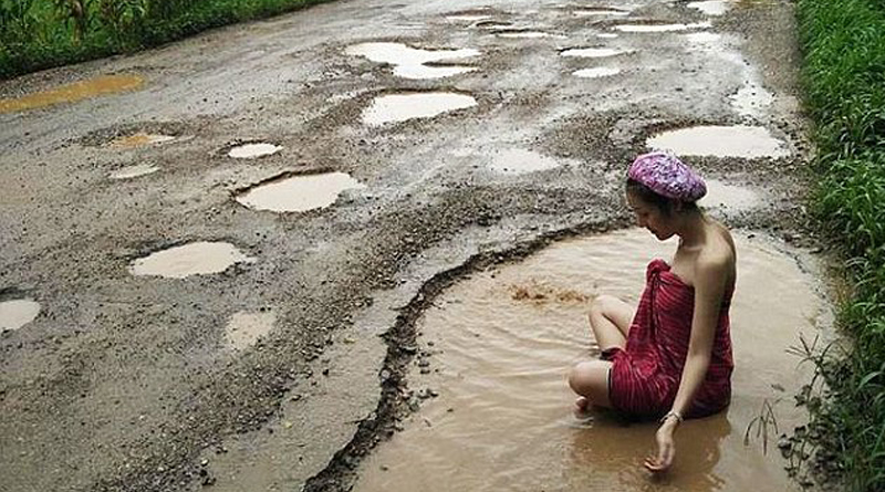 Thai Model Took Dip in Pothole to protest at the poor condition of roads