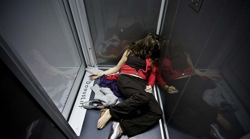 A woman trapped in a broken lift, drink urine to survive