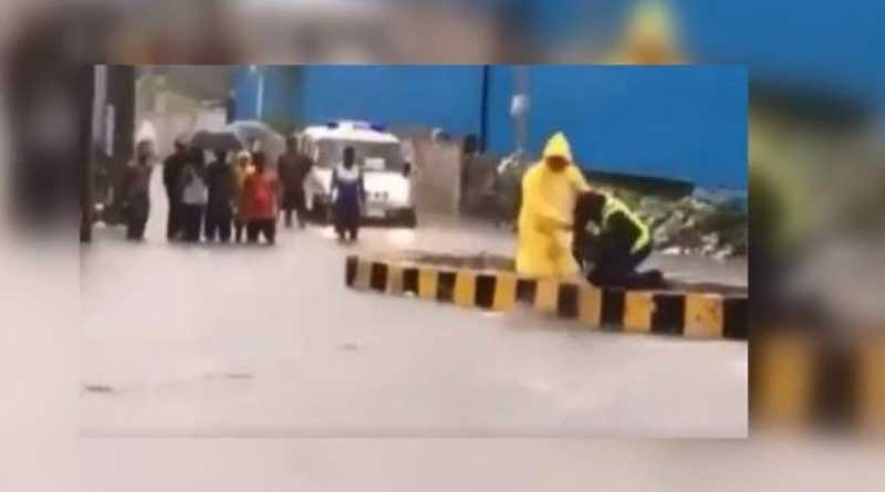 Mumbai Police saves stray dog from floating away by rainy water