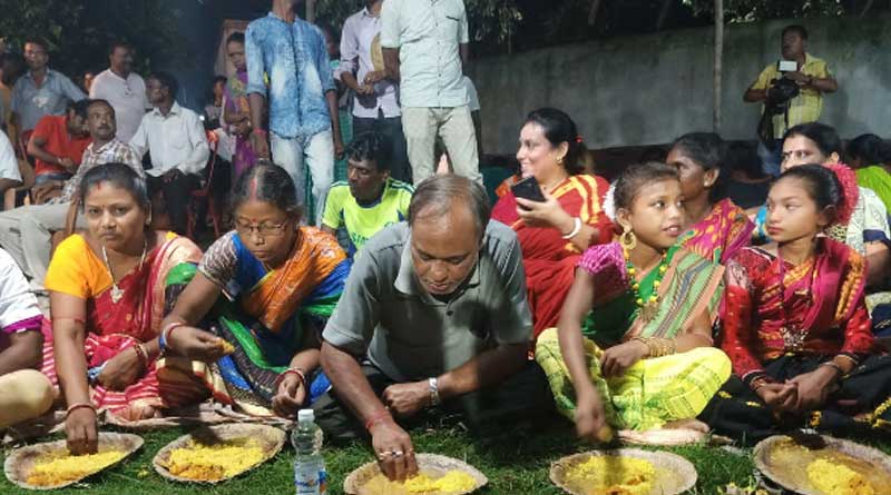 Locals welcome TMC MLA with garlands in a village at Kulti