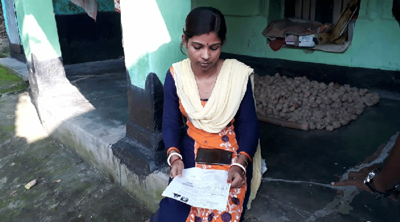 Woman stages protest in front of her in law's home in Balurghat