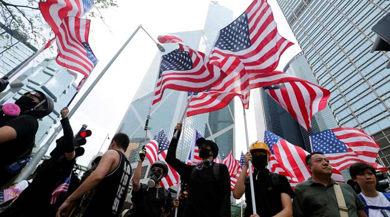 Hong Kong tells U.S. to stay out, pro-democracy protest intensifies