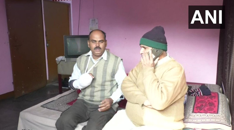 UP cop thanks local, Hajji Qadir, who rescued him mob