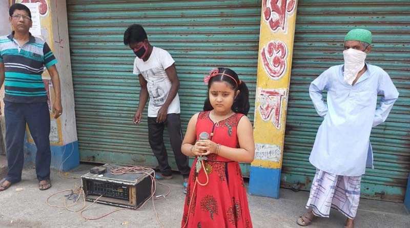 Six year old spreading awareness by singing at Bangao