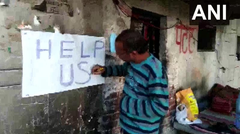 Haryana man puts 'Help Us' poster outside his home