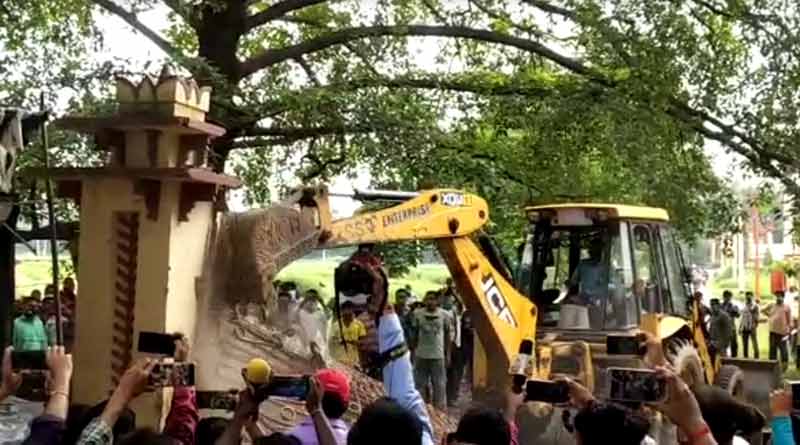 Local people ransack wall and gate of the Poush Mela premises in Shantiniketan