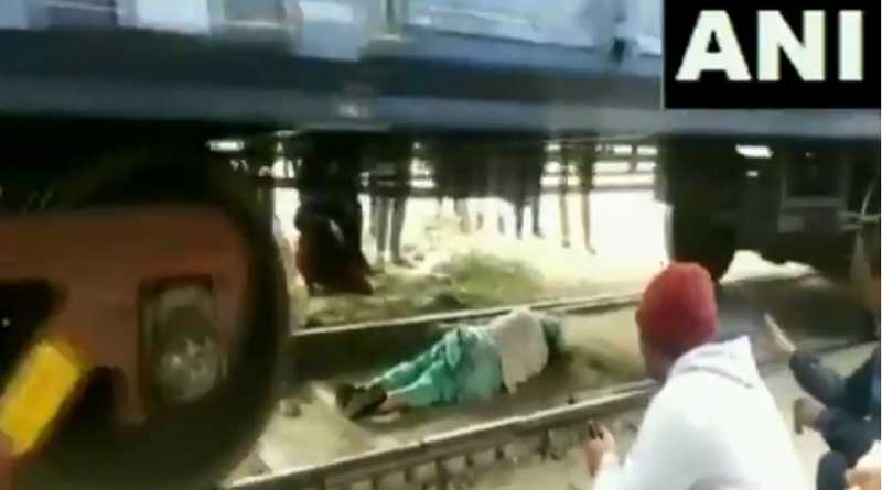 Woman’s Lucky Escape After She Gets Trapped Under Moving Train in Haryana’s Rohtak | Sangbad Pratidin