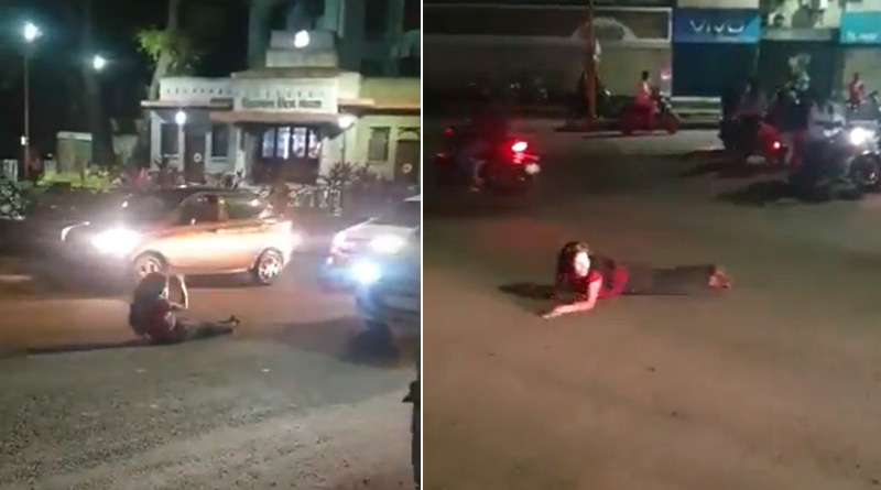 Drunk Woman Rolls Around & Sleeps on Road in Pune, Blocks Traffic | Sangbad Pratidin