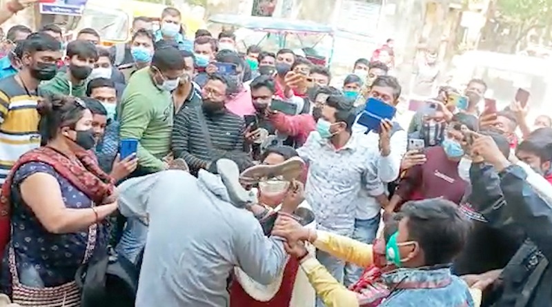 There is an allegation of black marketting of blood, protestors garlanded health worker with shoe | Sangbad Pratidin