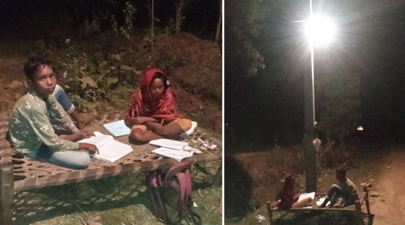 Sibblings of Jhargram studying in the light of lampost, picture goes viral | Sangbad Pratidin