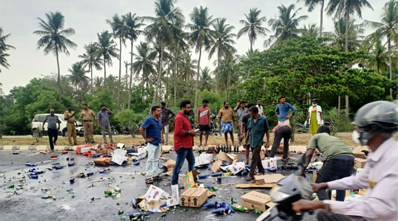 Locals loot liquor bottles after vehicle carrying liquor topples on Madurai highway