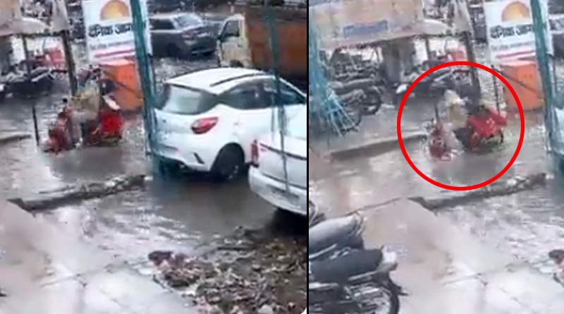 Policeman and his wife escaped with injuries after their two-wheeler fell headlong into a drain in Uttar Pradesh's Aligarh । Sangbad Pratidin