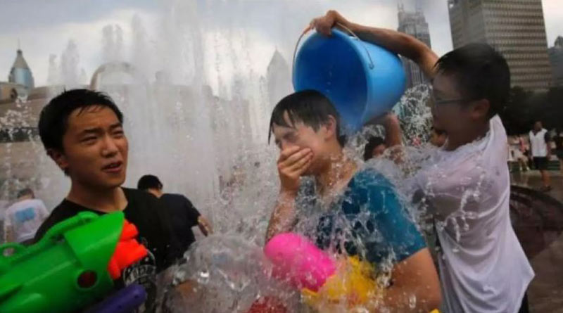 Heat waves in Shanghai, other Chinese cities buckle roads, pop roof tiles। Sangbad Pratidin