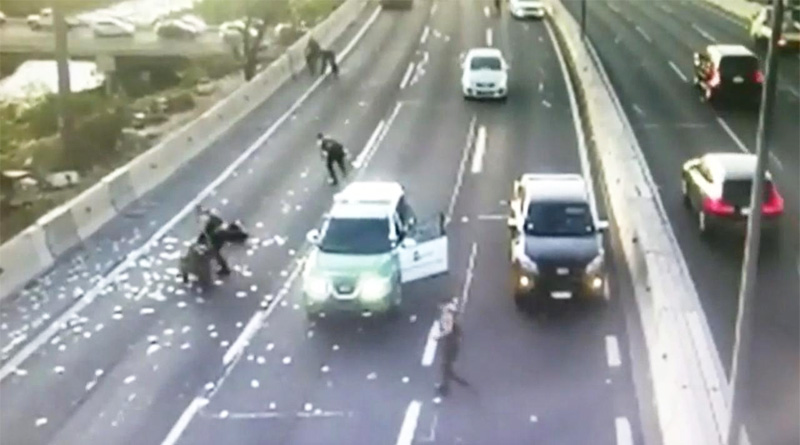 Viral Video of Money rains on highway in Chile | Sangbad Pratidin