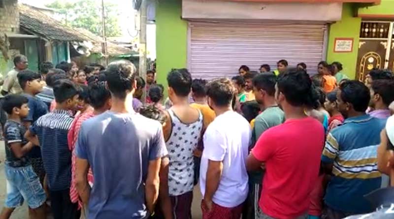 A woman allegedly beaten up by mob in Malda | Sangbad Pratidin