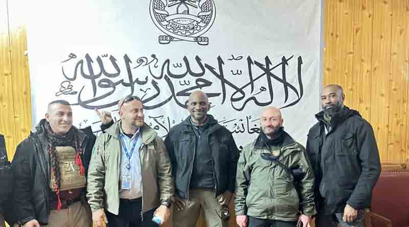 UN official in front of Taliban flag clicked photo in Afghanistan | Sangbad Pratidin
