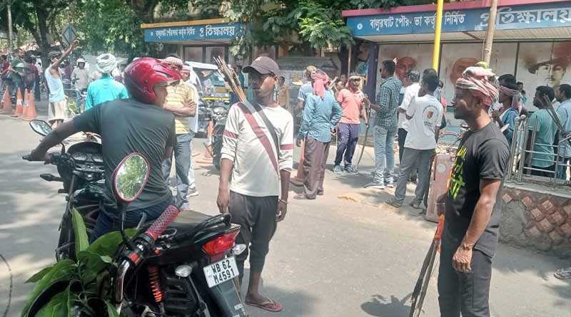 Tribals stage protest with bow and arrow against purification in many districts | Sangbad Pratidin