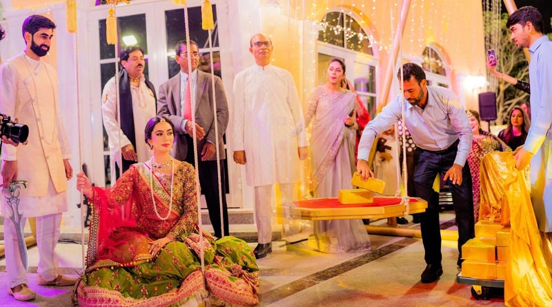Real story behind Dubai Bride weighed in 'gold' in lavish wedding, viral video | Sangbad Pratidin