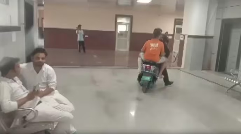No wheelchair at Kota hospital and man takes injured son to third floor on scooter | Sangbad Pratidin