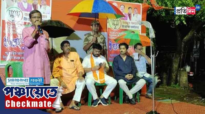 WB Panchayat Vote 2023: TMC tweets a picture of central force jawan who holding umbrella for BJP MLA । Sangbad Pratidin