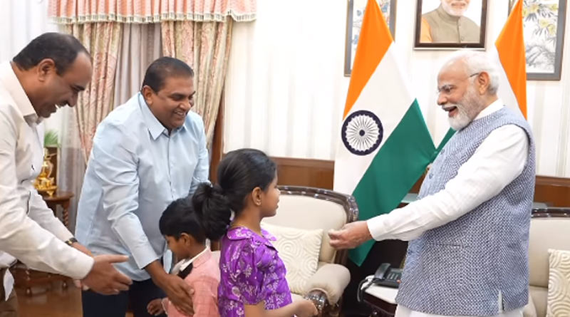 PM Modi tries coin trick during interaction with children। Sangbad Pratidin