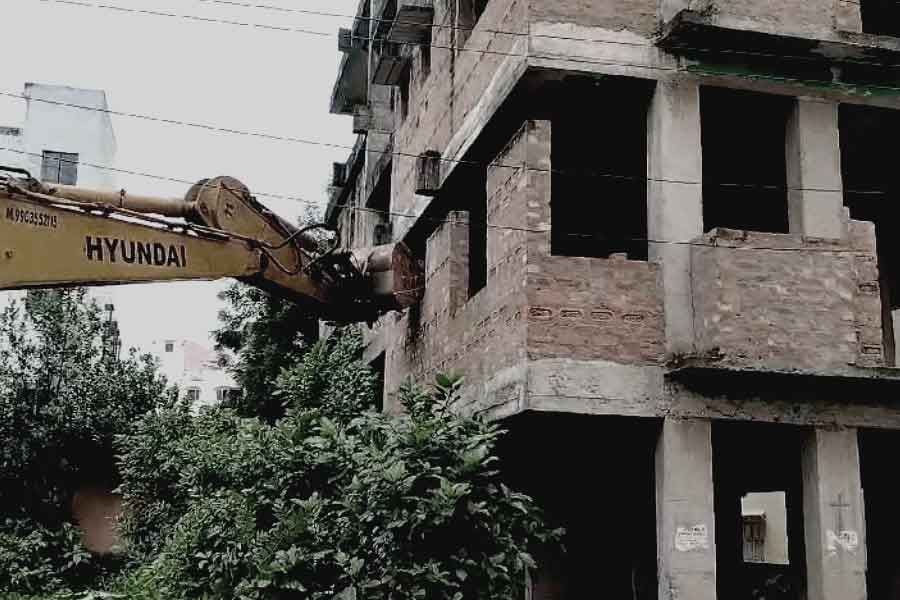 Administration demolishes illegal constructions by bulldozers in East Kolkata