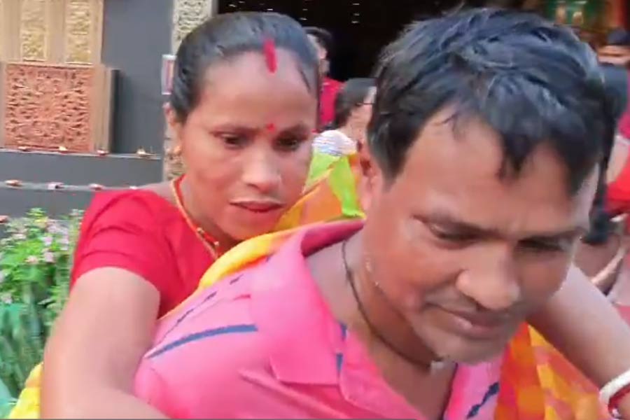 Durga Puja 2024: Husband carries wife to pandal hopping in Alipurduar as she is not able to walk