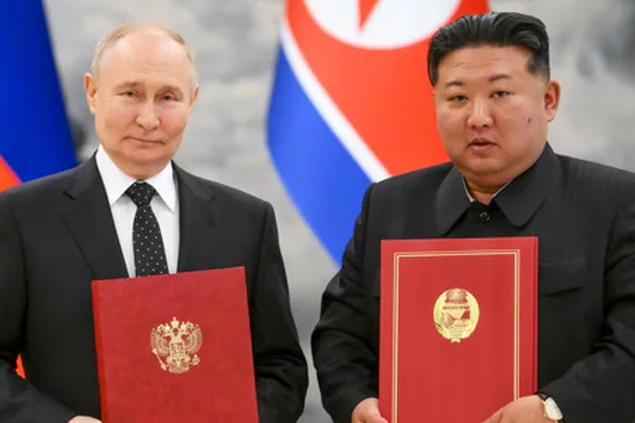 Vladimir Putin signs mutual defence treaty with North Korea