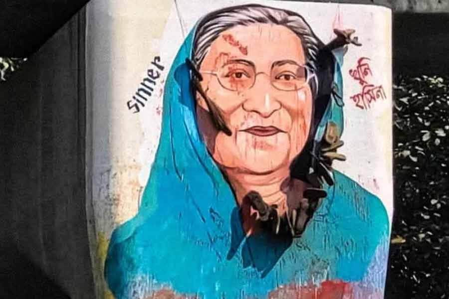 Student leaders throw shoes to the Graffiti of sheikh hasina in Bangladesh