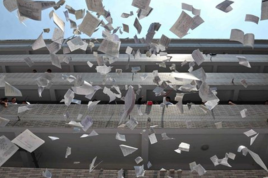 Madhyamik students celebrate by tearing books on the last day of exam in Falakata