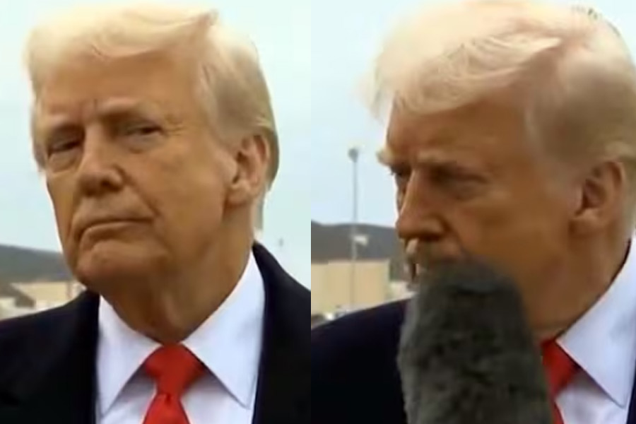 Donald Trump's death stare at reporter as she bumps microphone into his face