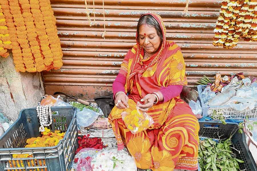 Maya Sardar sells flowers to support her family in Katwa