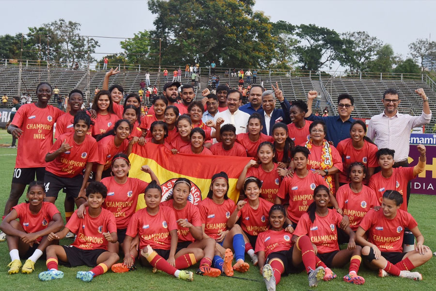 Sports Minister Arup Biswas receives the IWL trophy on behalf of East Bengal