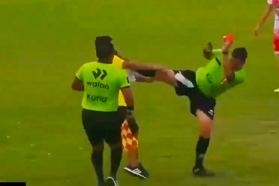 A referee kicks angry coach in the head during Copa Peru Football match