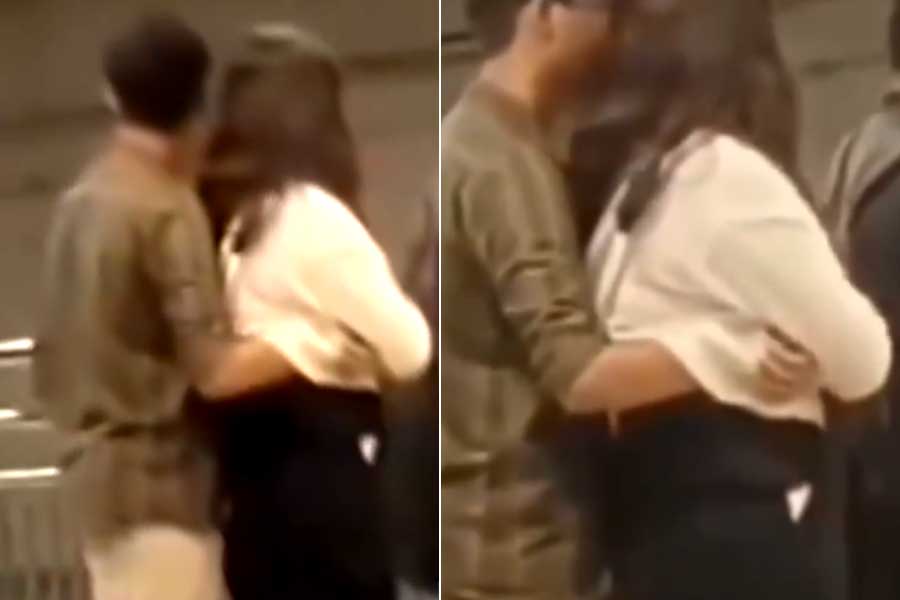 Couple behaving inappropriately while waiting to board a train at Bengaluru metro station