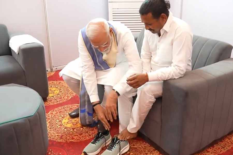 PM Modi Gifts Shoes To Man Who Vowed Not To Wear Footwear