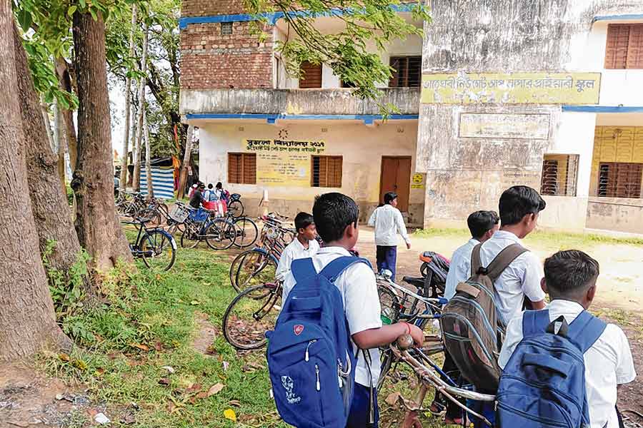 student are opening the school doors in Amta