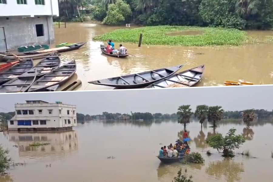 জলে ভাসছে ঘাটাল, নৌকাতেই পারাপার স্থানীয়দের, দুর্গতদের পাশে প্রশাসন